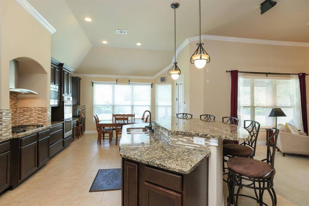 Cabinets with a medium brown stain is a traditional presentation. Garbage disposal 2025.