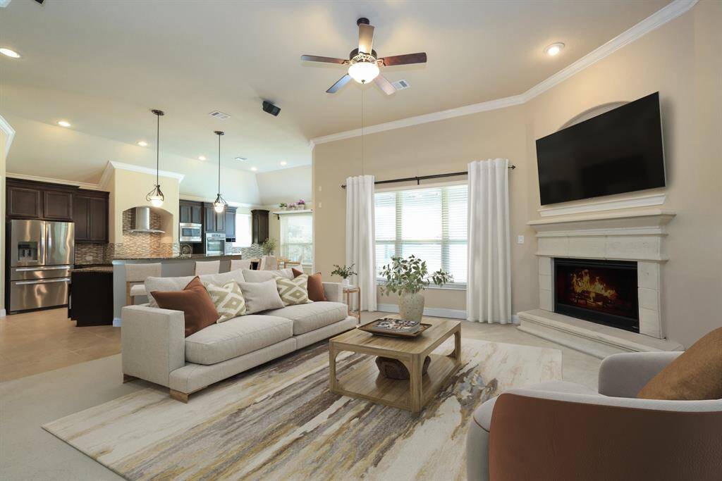 Cast stone fireplace with mantle and raised hearth.