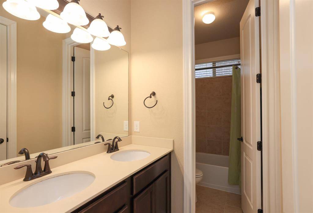 Double sinks and private bathing area on main floor.