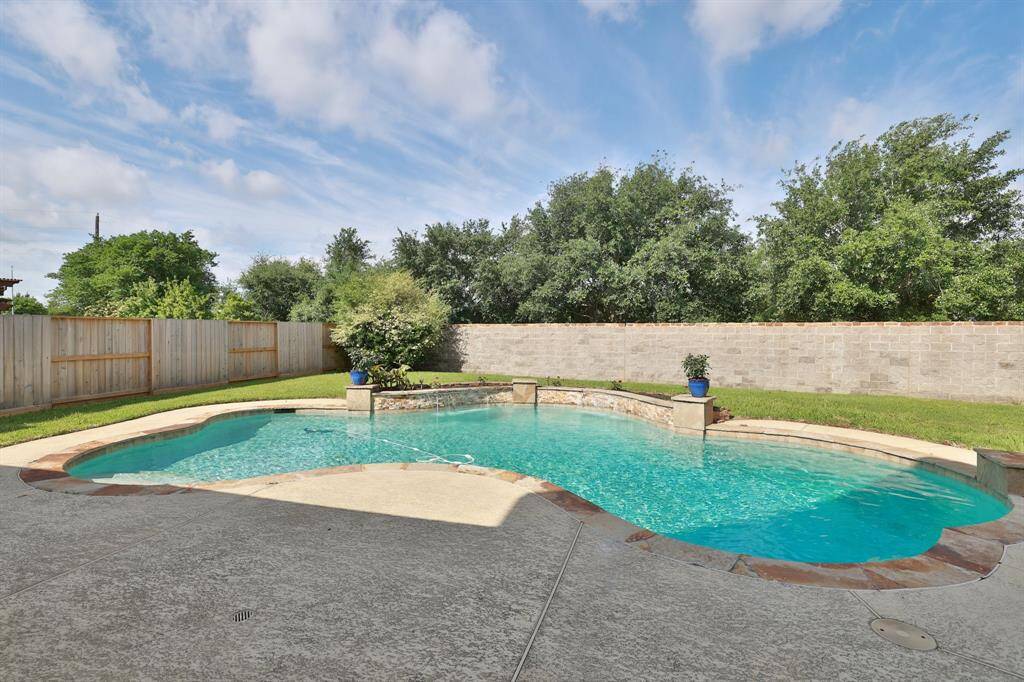 35 foot chlorine pool and is 8 foot at deep end. Sheer descent water feature and pool light.