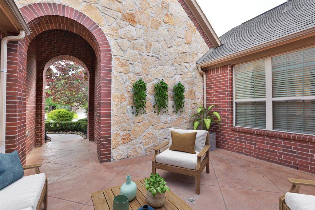 Bricked archway adds that custom touch with stone accents.