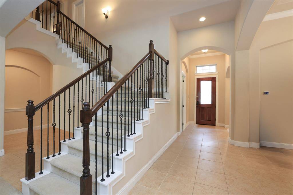 Tiled entry with back staircase