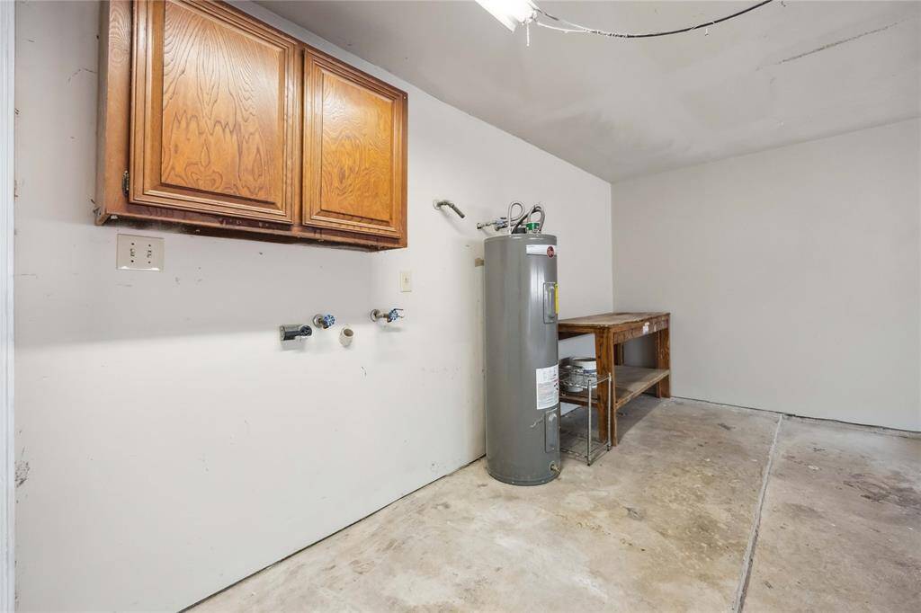 2-car garage with cabinetry. Perfect space for storage.