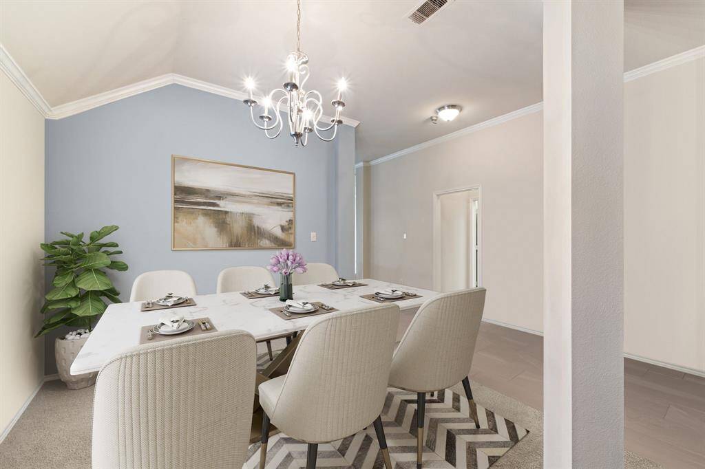Step inside and be greeted by an elegant dining room adorned with a dazzling chandelier, a sunlit window, and plush carpeting—perfect for hosting memorable dinners in style. *Virtually Staged*