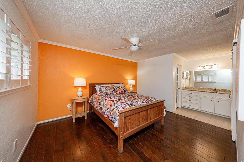 Your primary bedroom is at the front of the home and includes plantation shutters