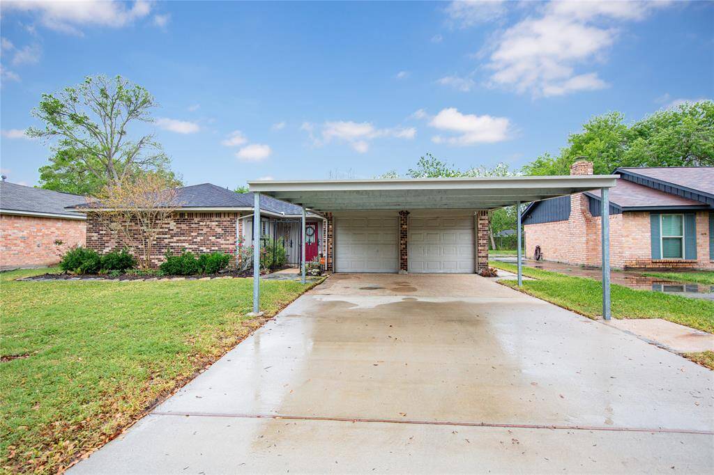 This home has a 2 car garage with a 2 car carport