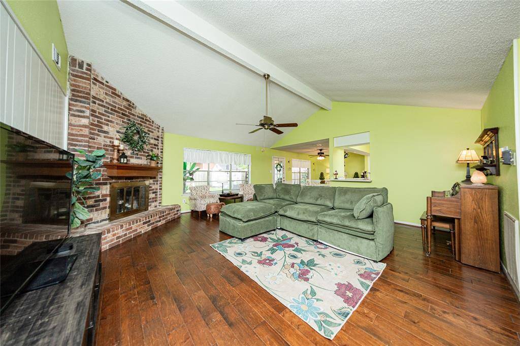 The living room flows into the breakfast room and kitchen.