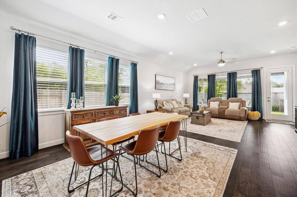 Dining area large enough for a spacious dining table - everyone can have a seat. Natural light from three large windows.