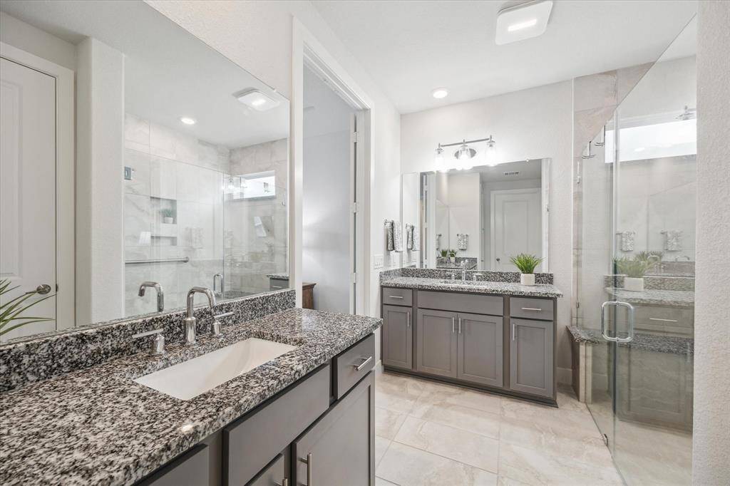 En-suite with double separate sinks and large walk in shower