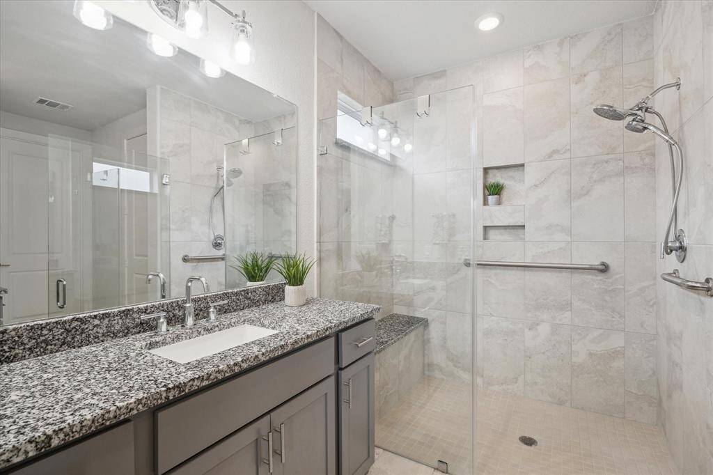 Zero=Transition Walk-in Shower with enlarged doorway and door.  Including a bench built inside.  This shower has it all.