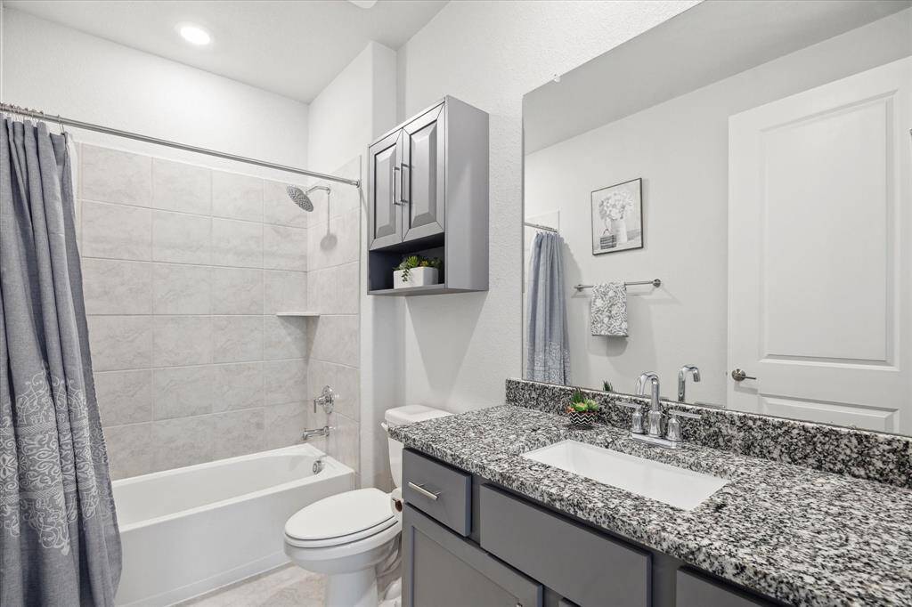 Guest bathroom with bright recessed lighting.