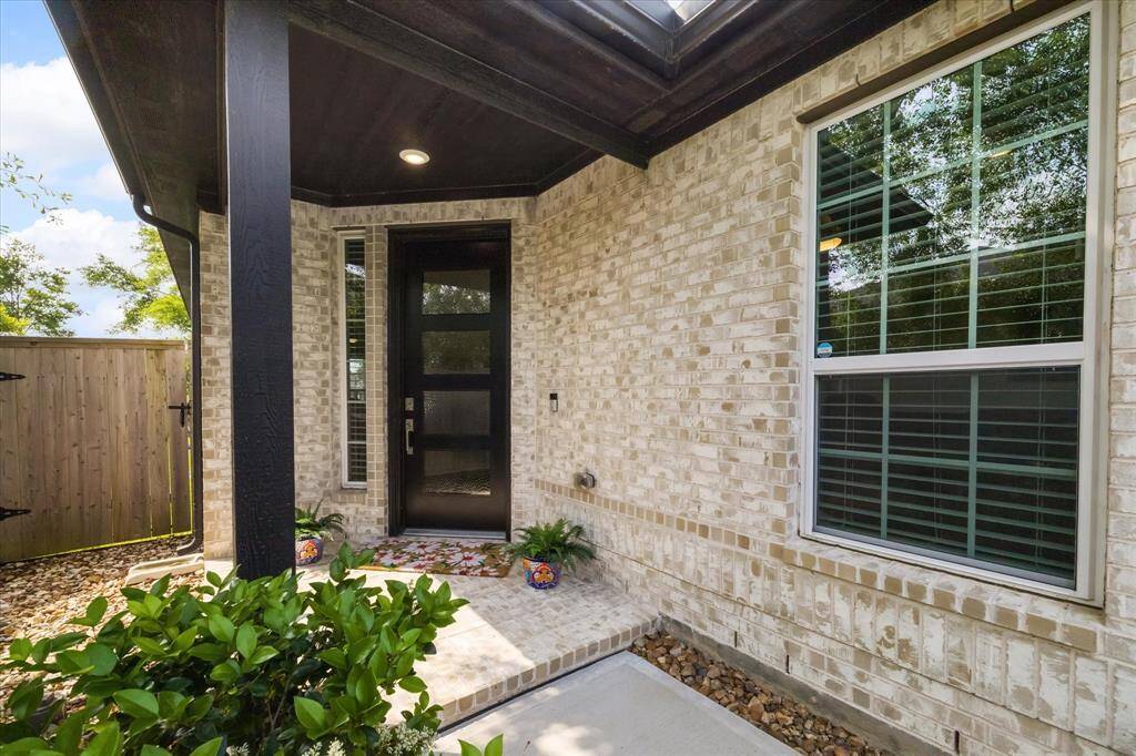 Front porch entrance with a grand 8' front door. A warm welcome.