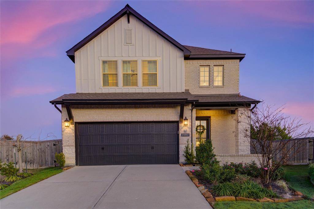 Located in the esteemed Bridgeland community, this recently constructed Lennar home boasts stunning curb appeal with a beautifully landscaped front yard and a welcoming covered entryway.