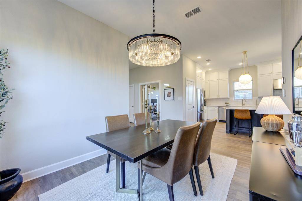 The Seller hand selected every detail in this home and the lighting is spectacular! Check out this gorgeous chandelier in the dining room--entertain in styleA