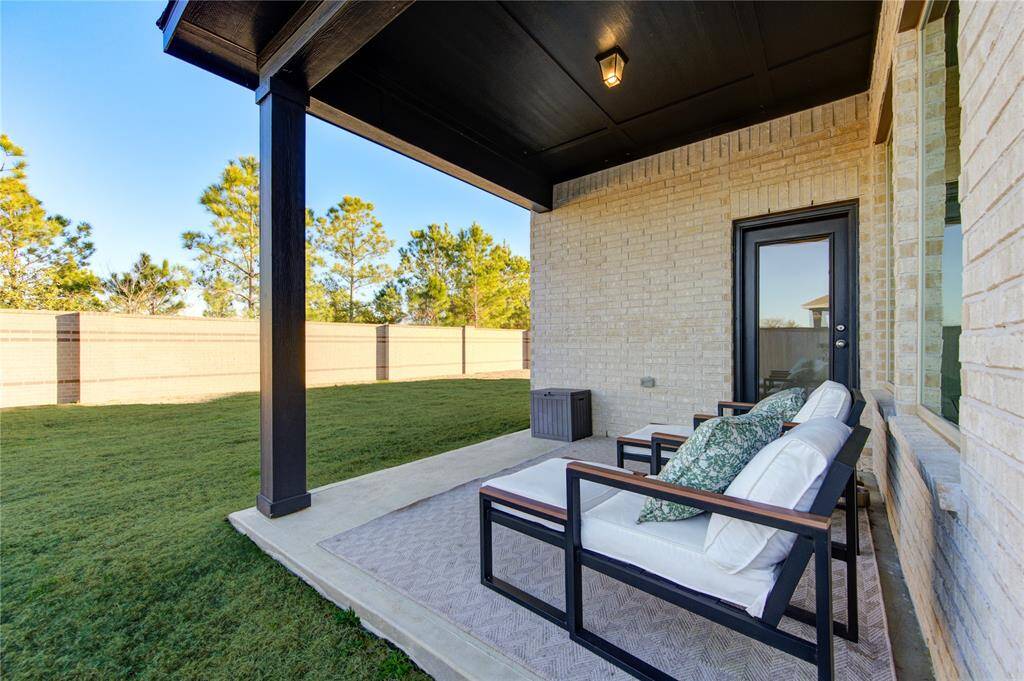 Step outside to a covered patio with a gas line for grilling—ideal for outdoor dining and relaxation.