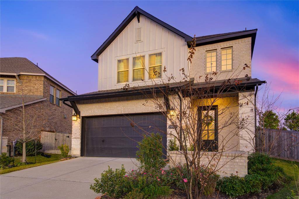 This beautifully designed Lennar home in the esteemed Bridgeland community showcases modern architectural details, a charming front porch, and professional landscaping that enhances its inviting curb appeal.