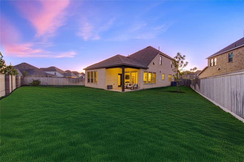 Step into a spacious and private backyard, offering lush green space perfect for outdoor enjoyment. Whether you're looking to host gatherings, let pets roam freely, or simply relax in a serene setting, this backyard provides endless possibilities.