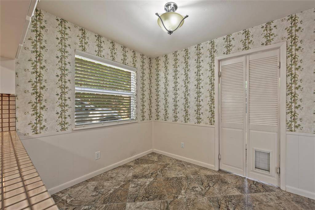 Breakfast room with door to laundry room