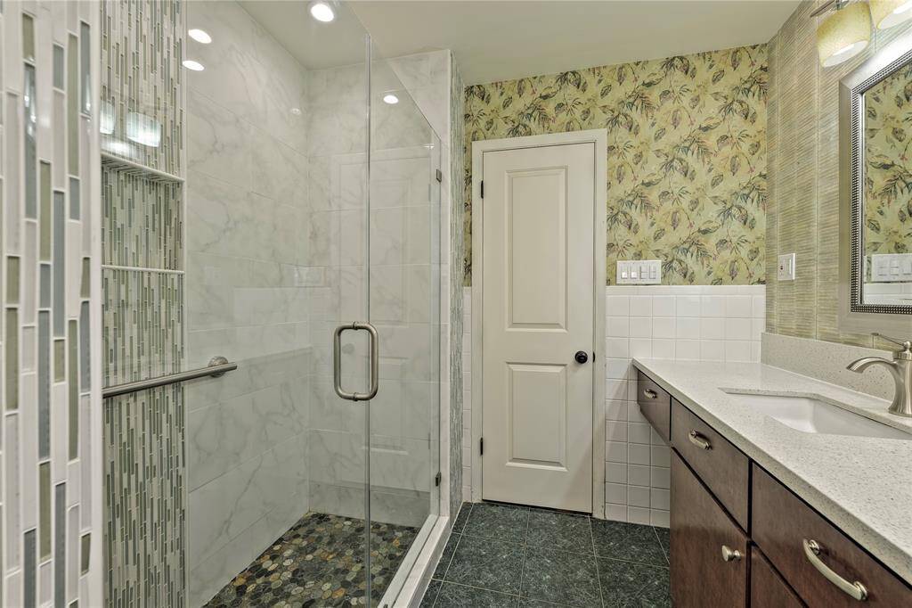 Large Shower and custom cabinets with Quartz Countertops and dual sinks