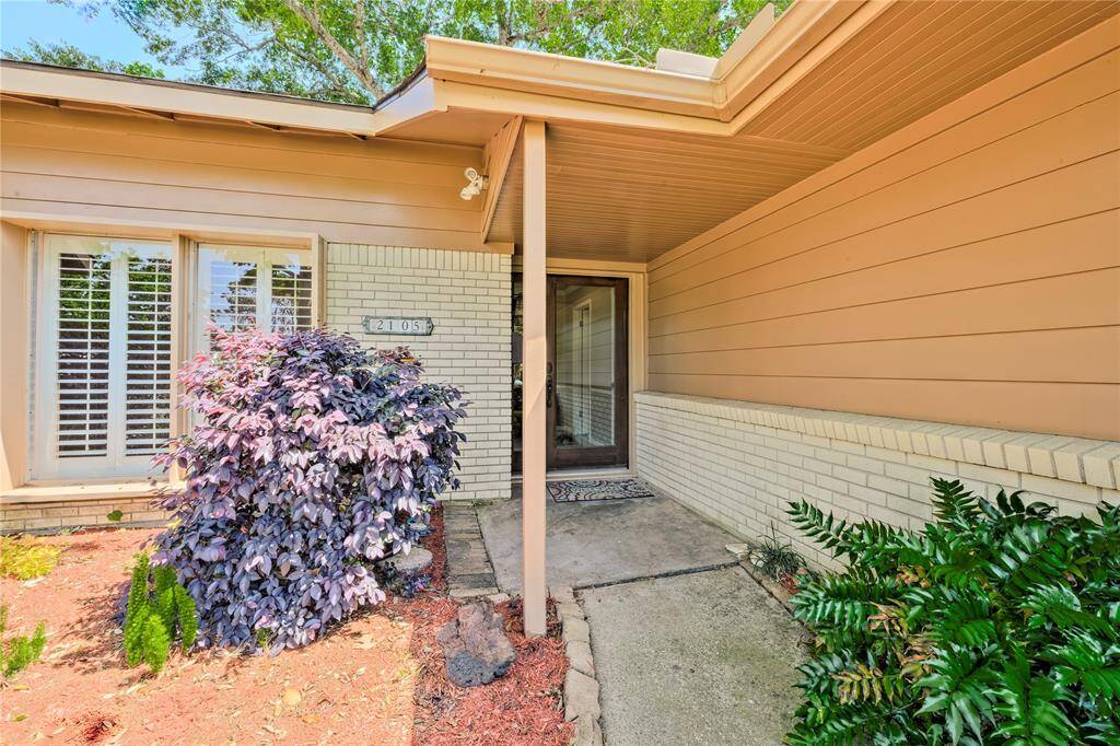 Inviting Entry with lucious landscaping