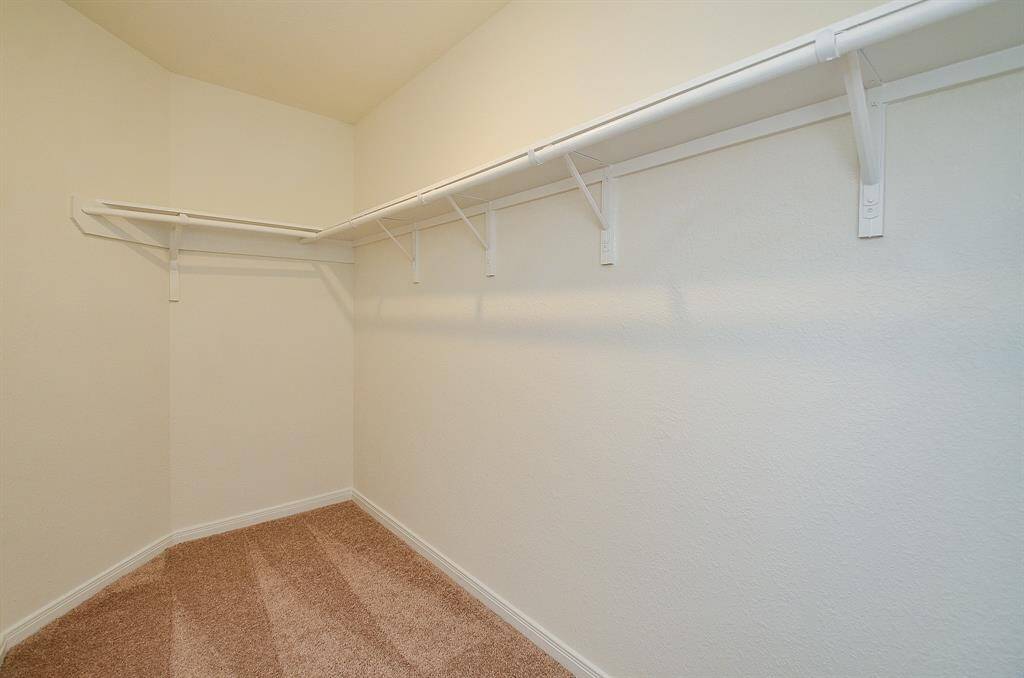 The Primary Bedroom Walk-in Closet.