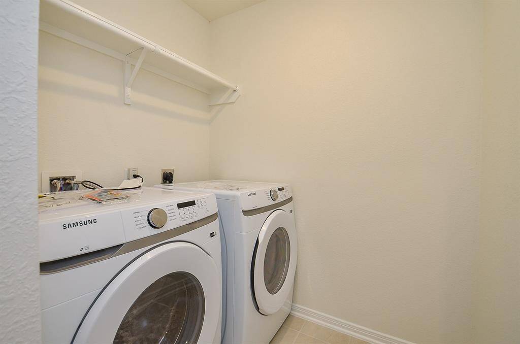 The Utility Room with Samsung Washer and Dryer set.