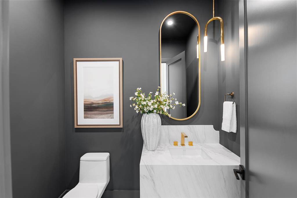Designed with intention, this half bath pairs bold sophistication with refined materials.