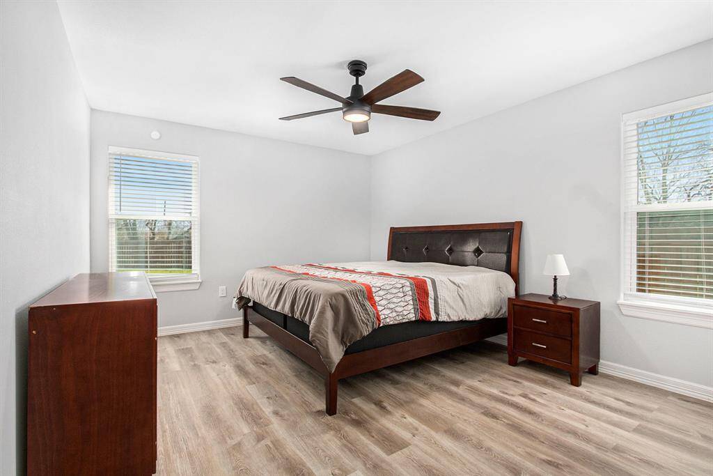 The master bedroom is on one side of the home, offering privacy. The windows offer a lot of natural light.