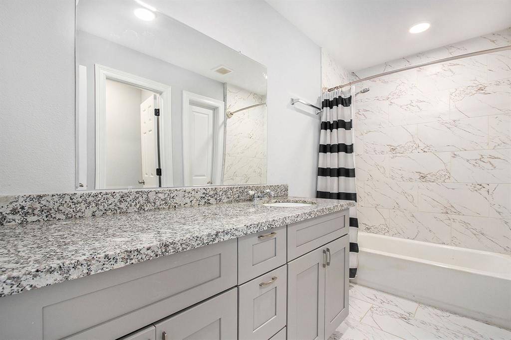 The master bathroom has beautiful granite counter top, along with beautiful tile on the shower/tub combo, Private water closet and custom walk in closet.