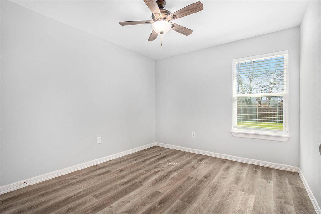 The 3rd bedroom is located on the back of the home with a view of the beautiful backyard.