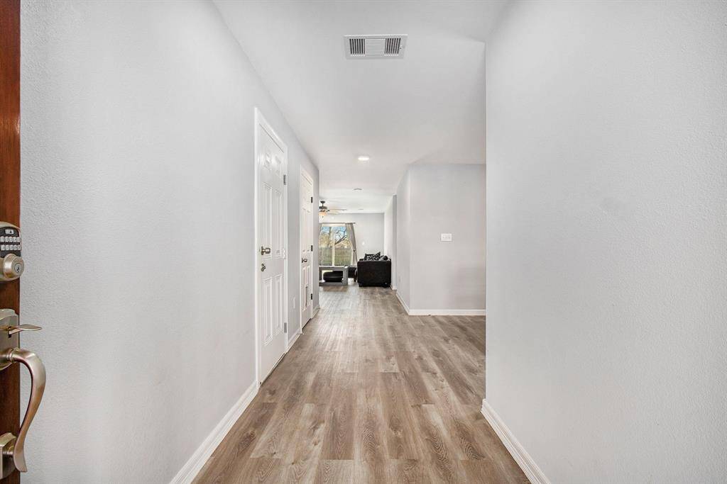 A spacious foyer is welcoming you in.