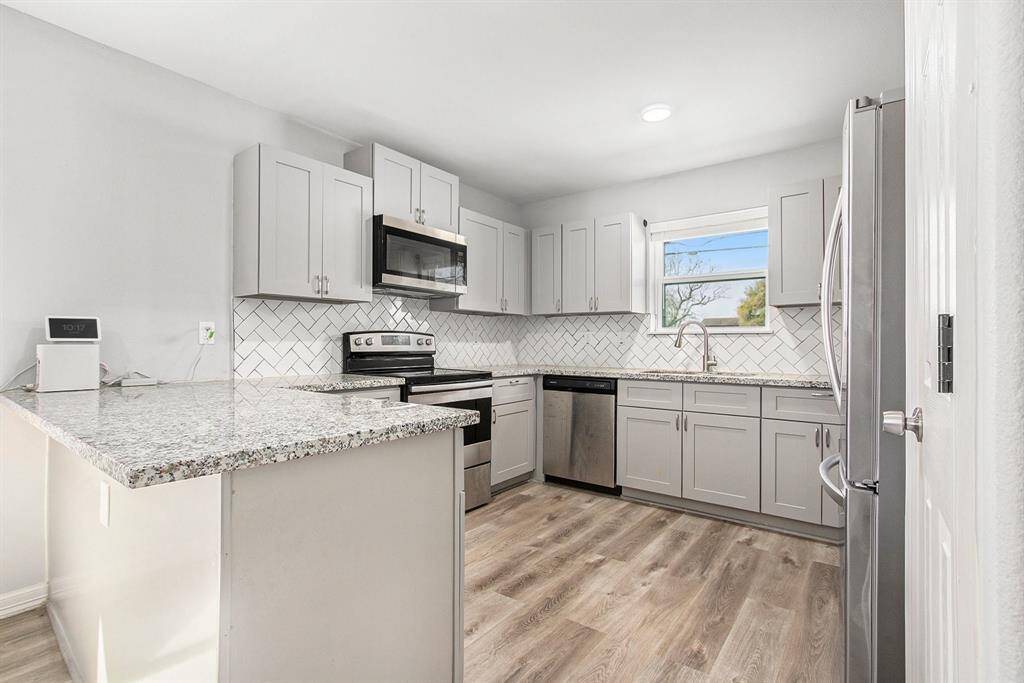 The spacious kitchen perfect for all your needs. Plenty of storage, amazing counter space. With a window above the sink and the a great pantry, makes this the perfect kitchen.