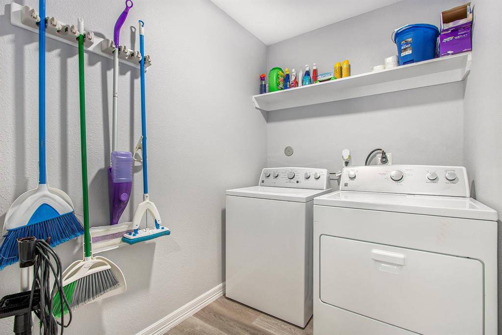 Laundry room is very spacious, with plenty of selves storage.