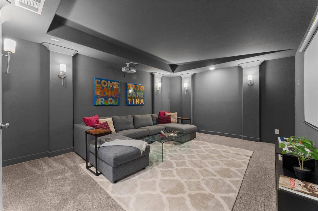 Dedicated media room designed for the ultimate movie night experience—complete with a projector, screen, and surround sound wiring. A cozy, theater-style atmosphere for relaxing evenings.