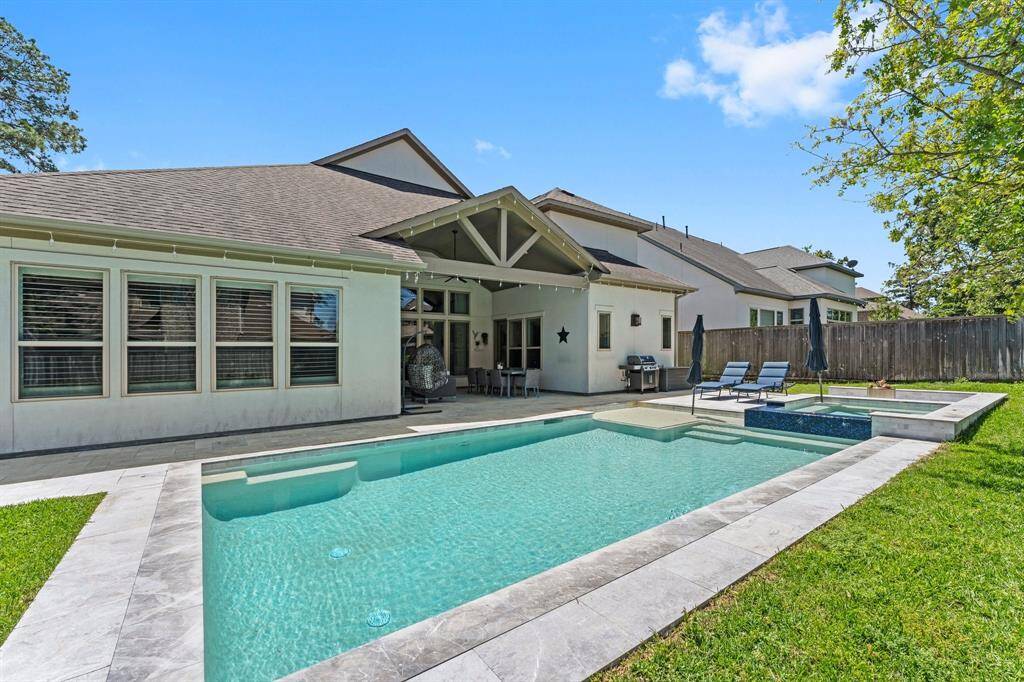 A close-up look at the luxury pool’s crisp lines, shimmering water, and upscale tilework, with a bubbling spa that invites you to unwind day or night.