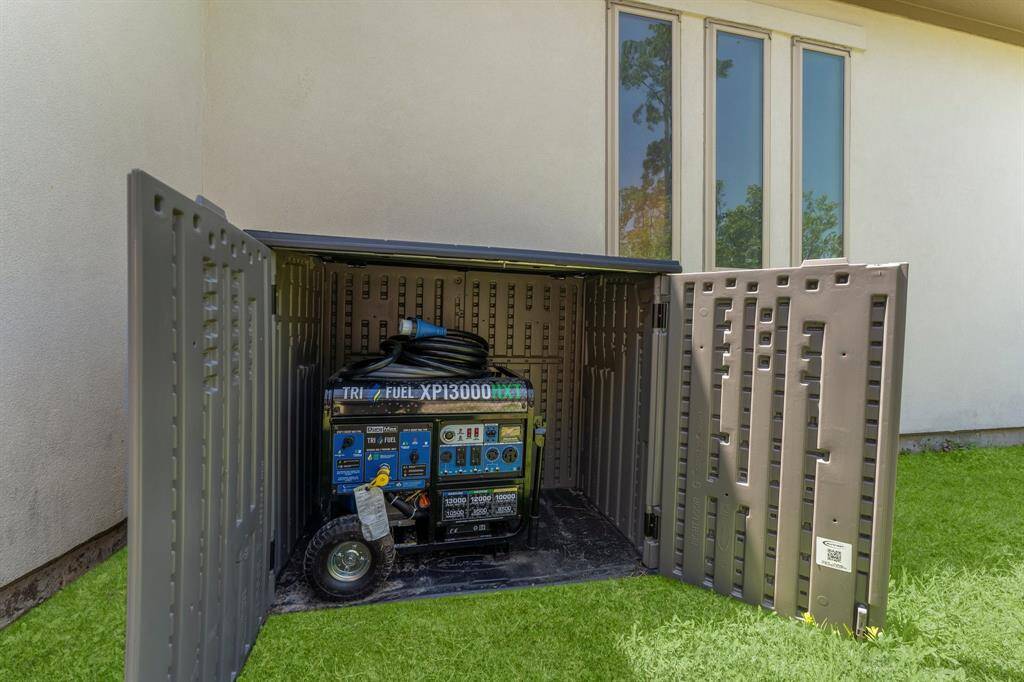 A backup power solution is discreetly housed on the side of the home—this high-capacity generator provides peace of mind and uninterrupted comfort during unexpected power outages.