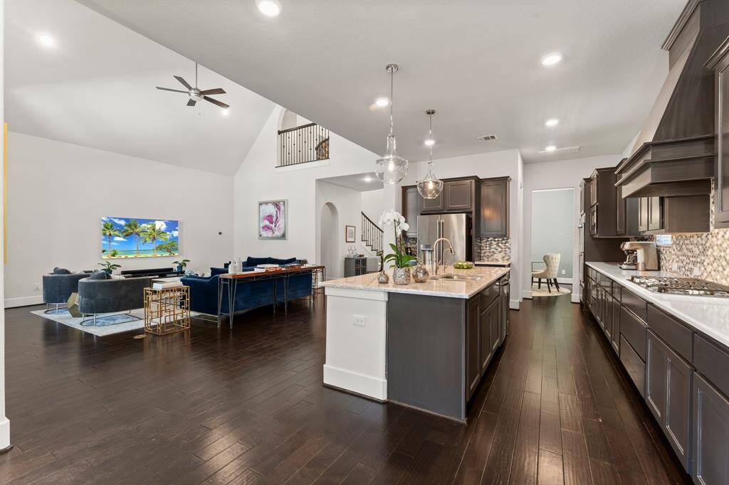 Seamless open-concept design connects the kitchen to the spacious living area, creating the perfect flow for everyday living and upscale entertaining.