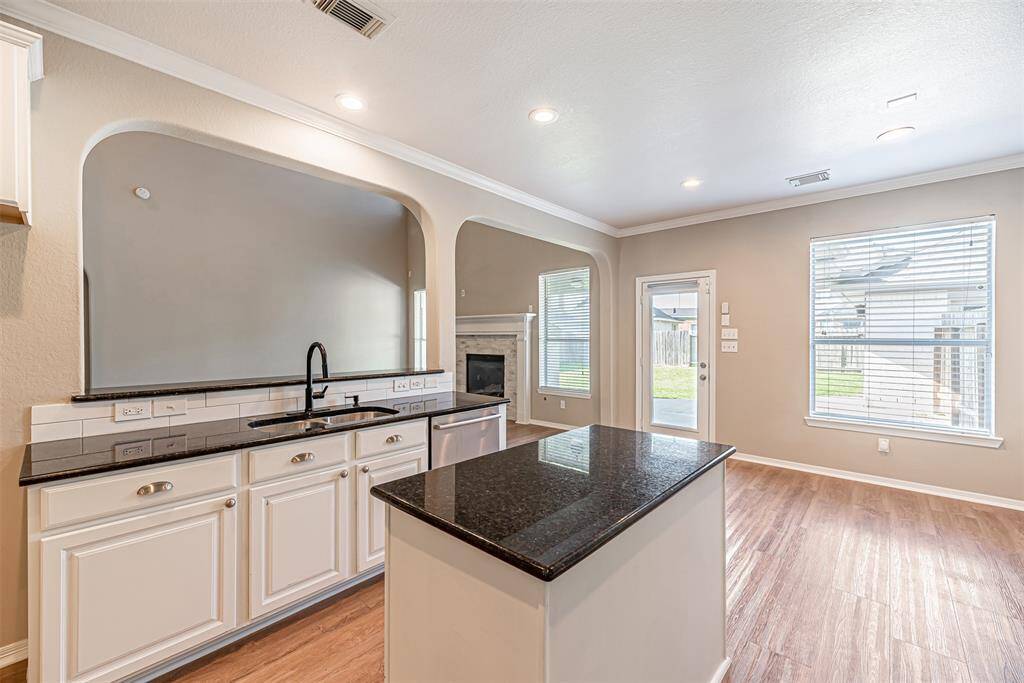 Kitchen is open to the family room and features a breakfast bar, which makes entertaining a breeze