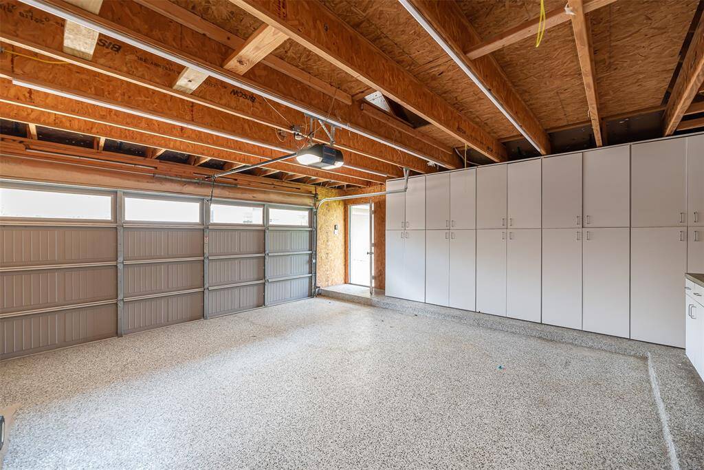 Home has an two car detached garage with wall of cabinets for storage.