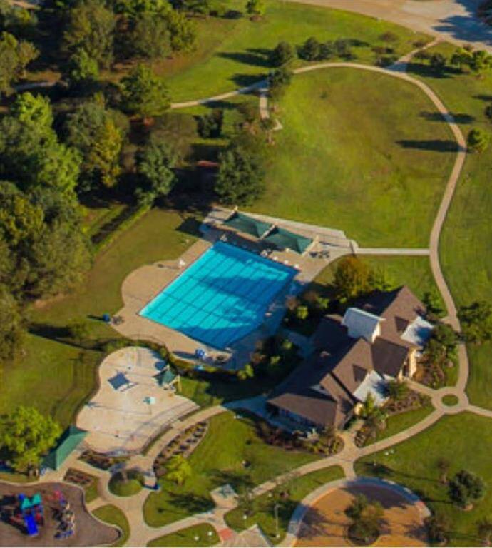 View of the splash pad, playground and swimming pool.
