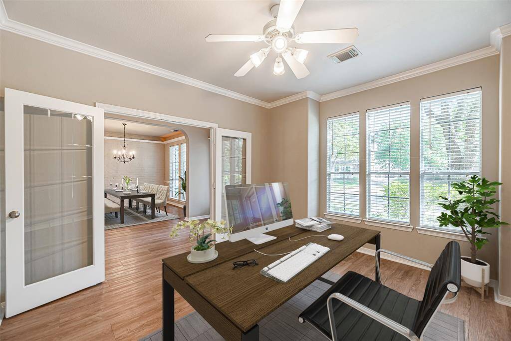 The study is just off the front entry with glass french doors and 3 picture windows overlooking the front yard. *Virtually Staged*