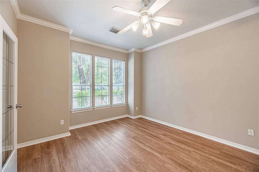 The study also has a ceiling fan, lvp flooring and crown molding.