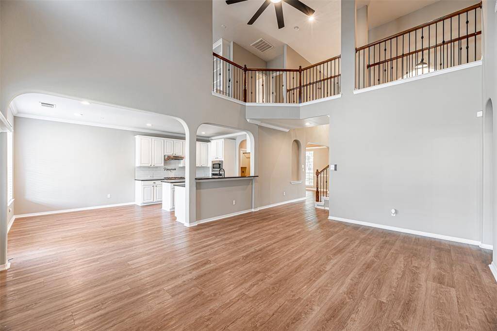 Alternate view of the family room that is open to the kitchen and upstairs cat walk.