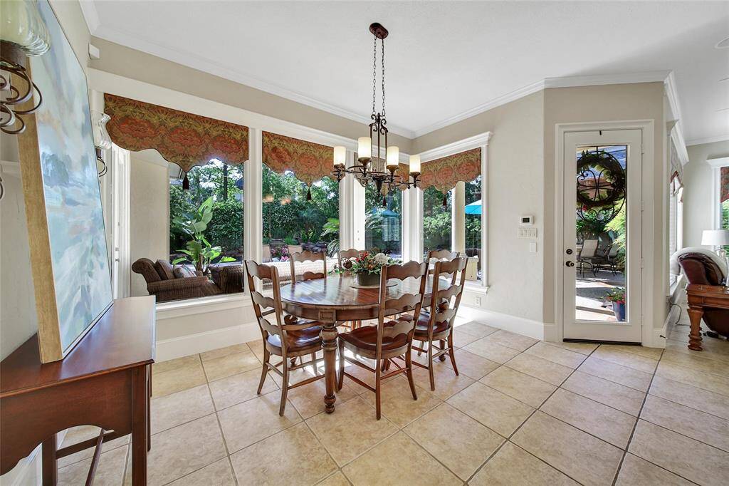 Breakfast room can seat many. Looks out onto the gorgeous backyard.