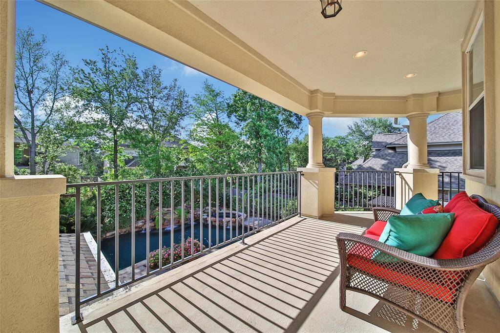 Balcony looks over the backyard oasis.