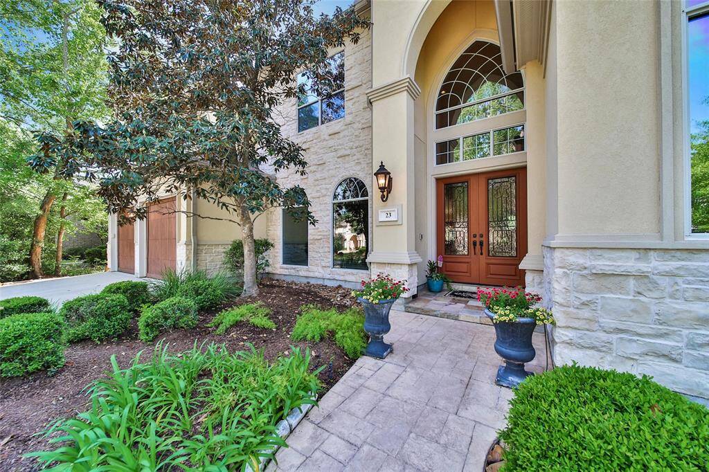 Lovely Double Door Entry to this custom home.