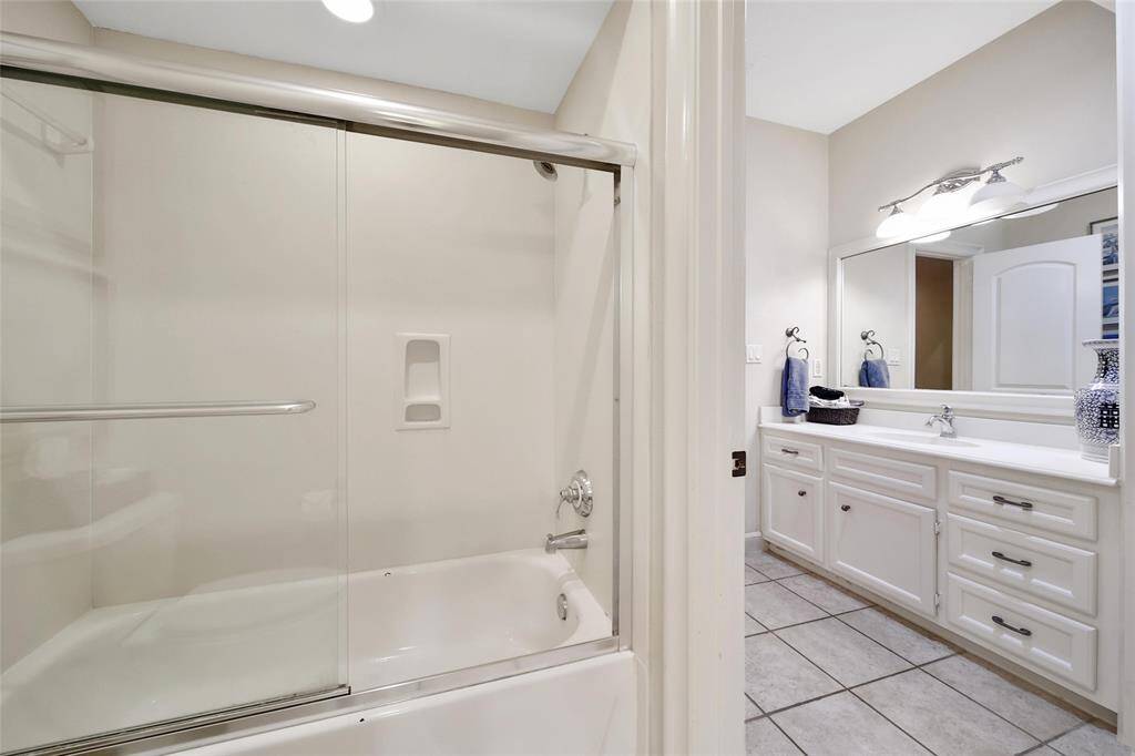Full bathroom leads to the sink/vanity for the next bedroom.