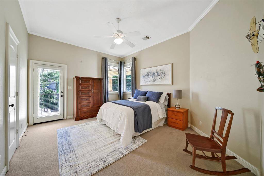 Another view of this bedroom shows a door that opens up to the balcony.