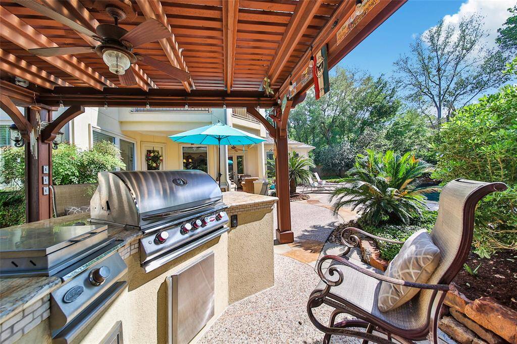 Shady spot to grill by the pool.