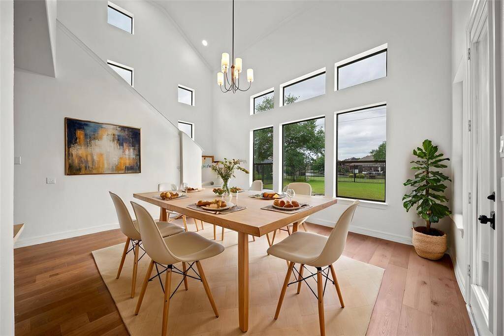 The breakfast room is light and bright overlooking the backyard and water